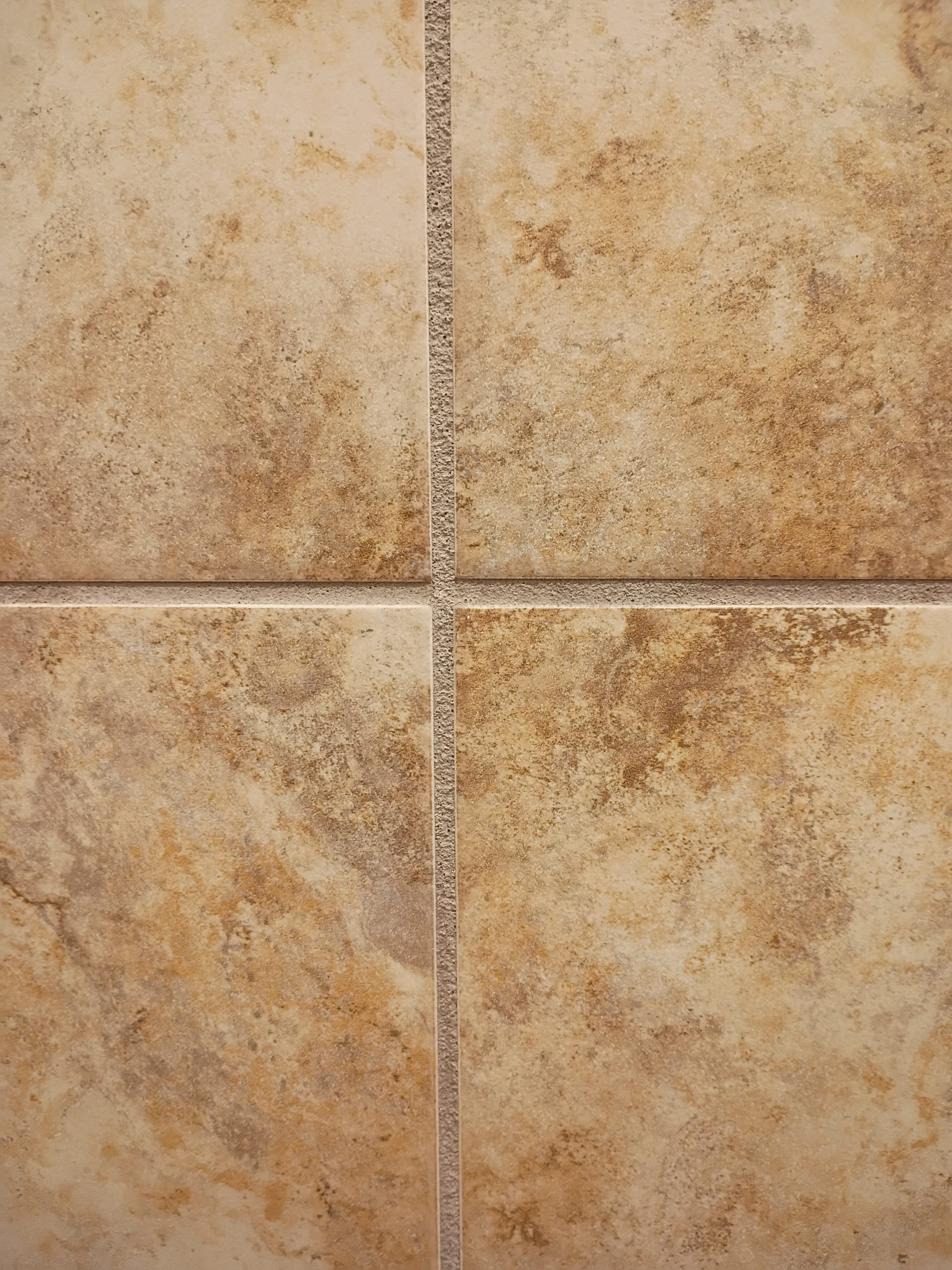 four suares of tile showing clean tile and grout